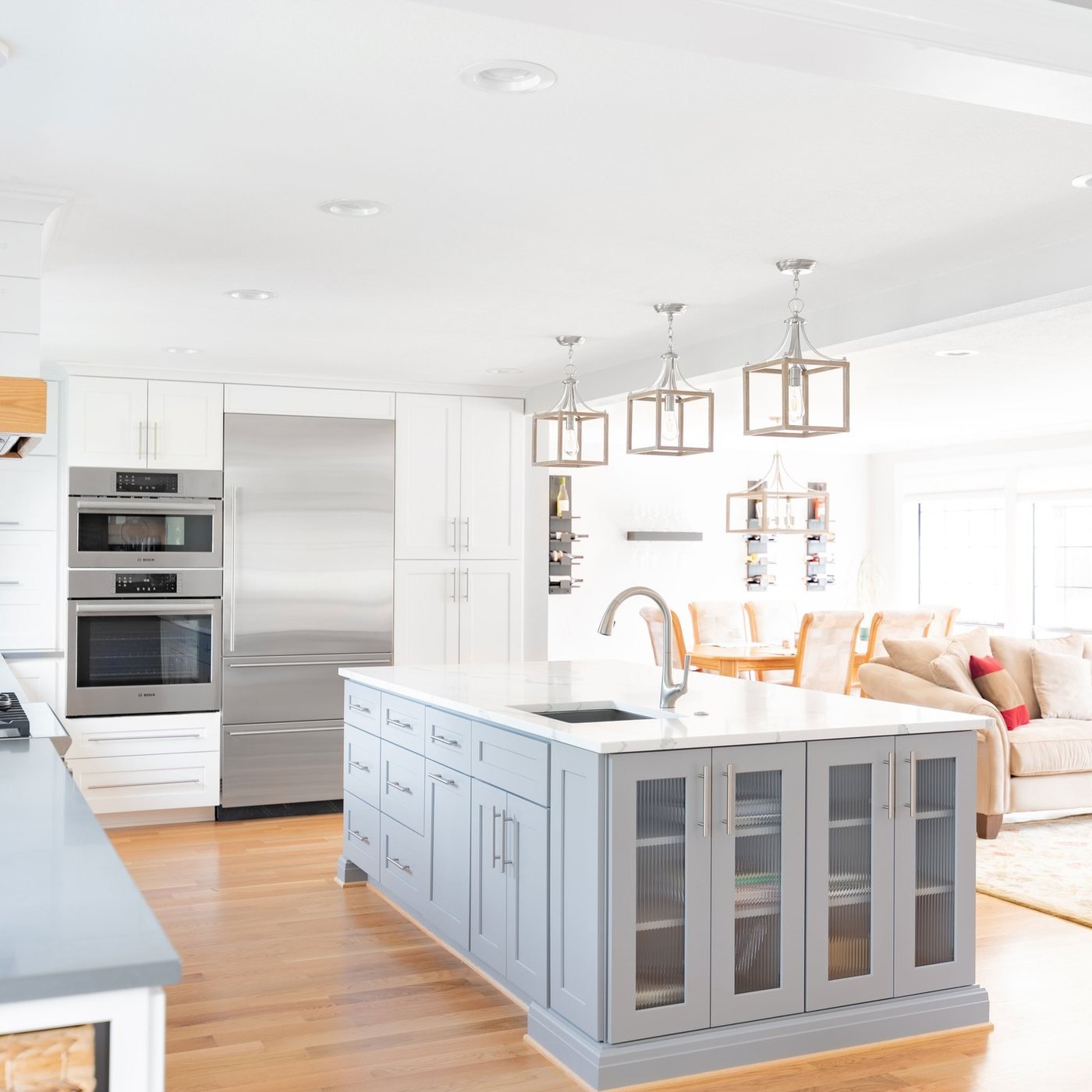 Bright white kitchen remodel with an island and pendant lighting