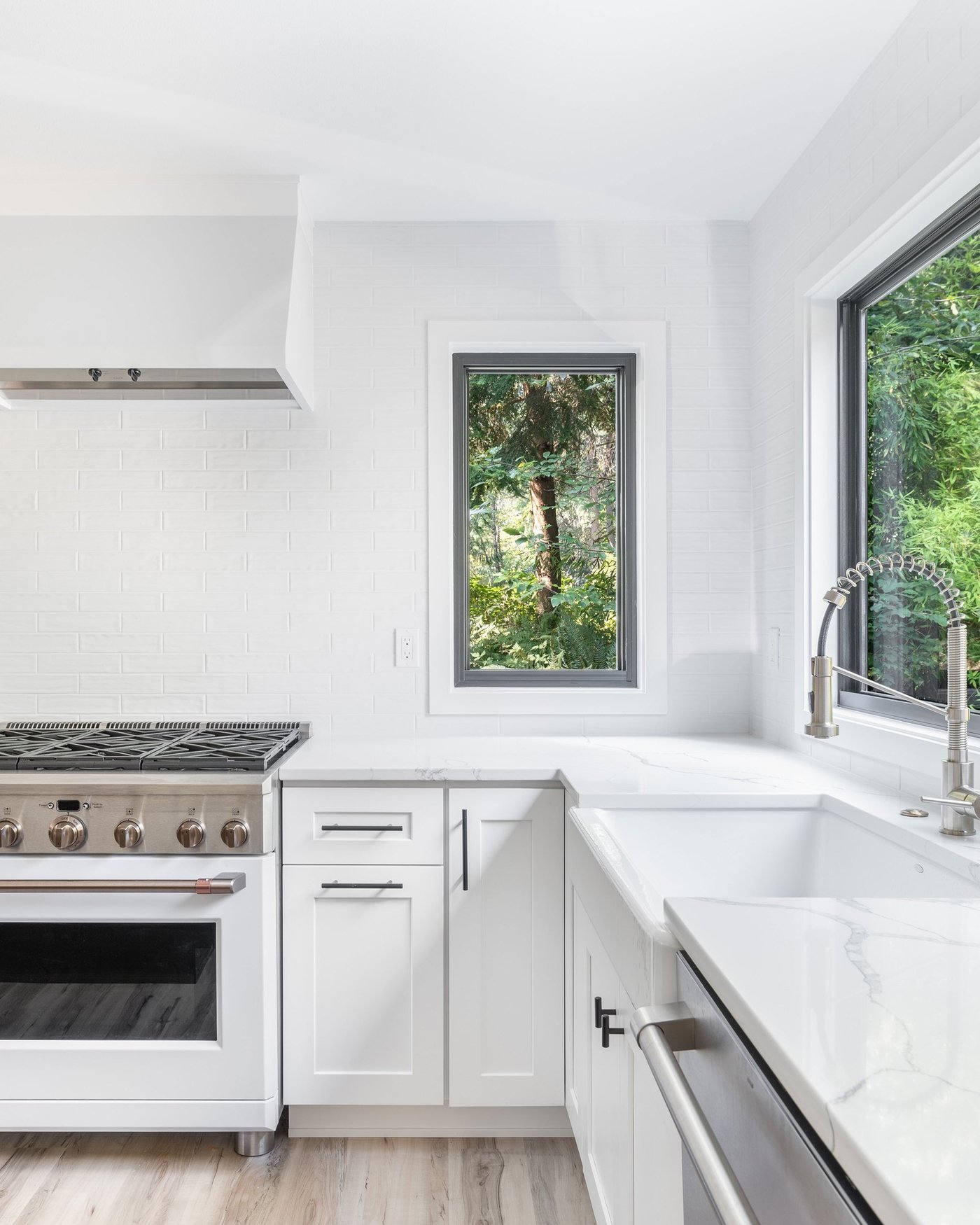 Kitchen with a professional range and a large picture window