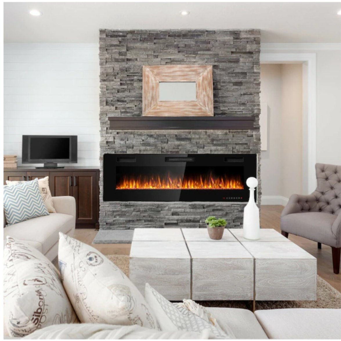 Living room with a stacked stone fireplace and mounted television