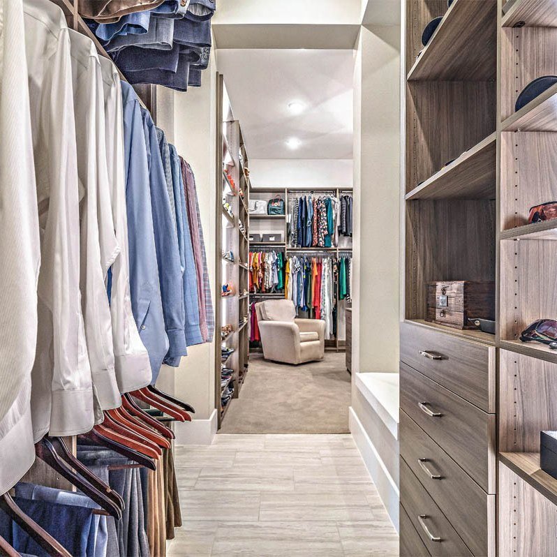 Walk-in closet with custom organizers and shelving